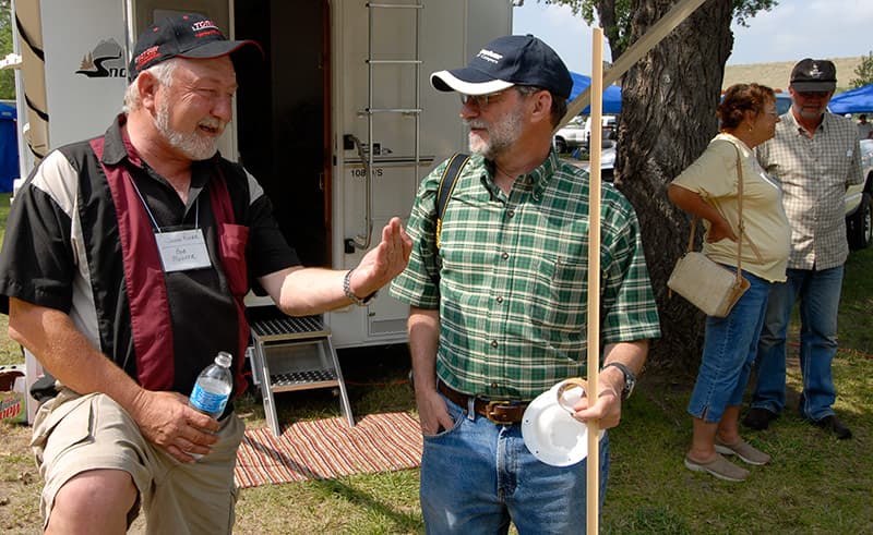 Bob Mehrer talking to an attendee