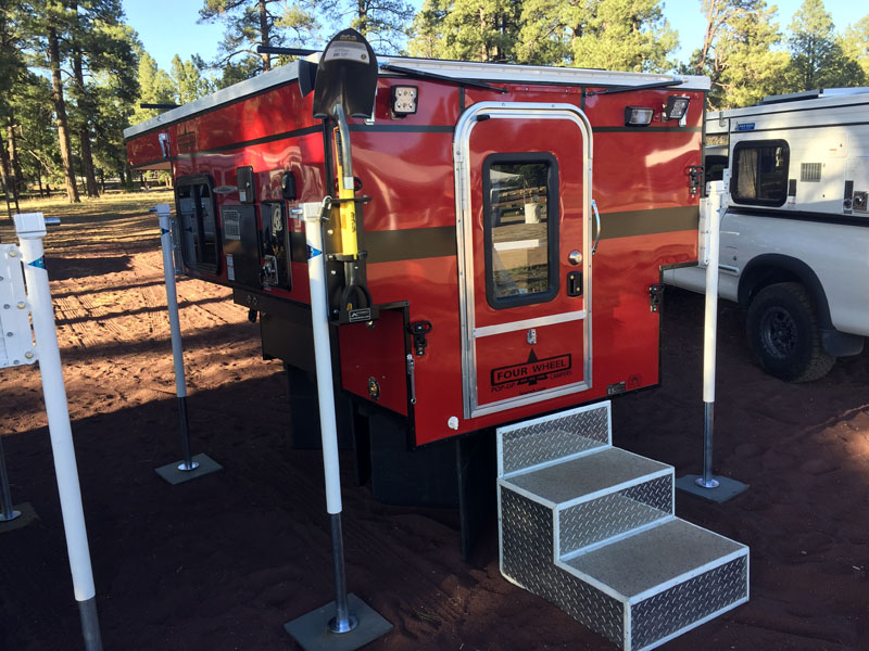 Four Wheel Camper with Shovel In Red