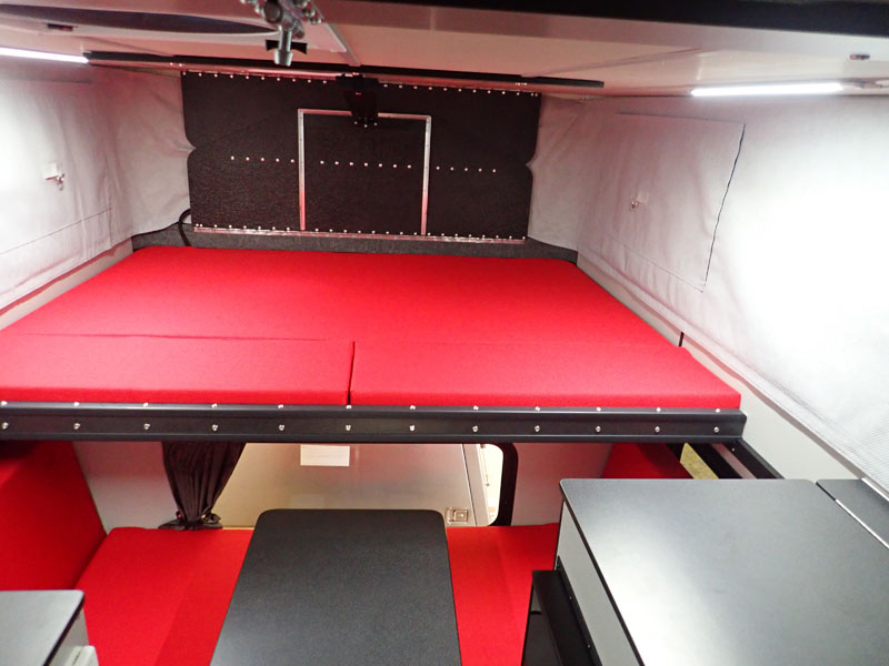 Four Wheel Red Camper Bed