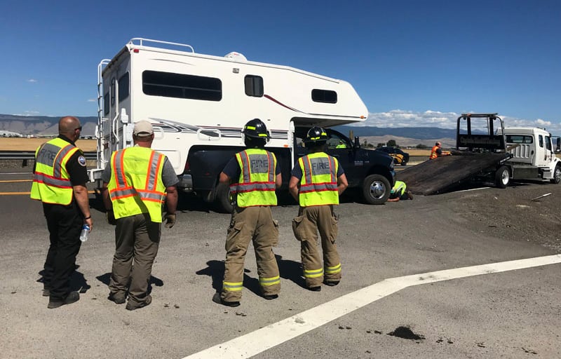 Rescue Guys Watching Rig On Truck