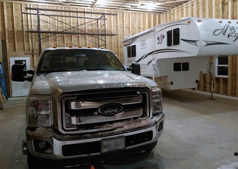 Truck And Camper In Garage Facility