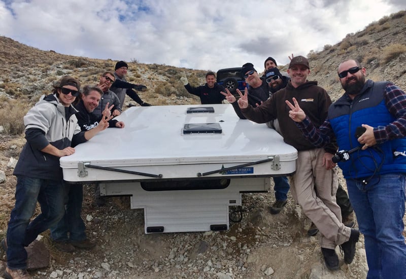 12 Guys About To Lift Camper