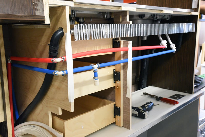 Alde Hydronic System Fins Behind Cabinetry