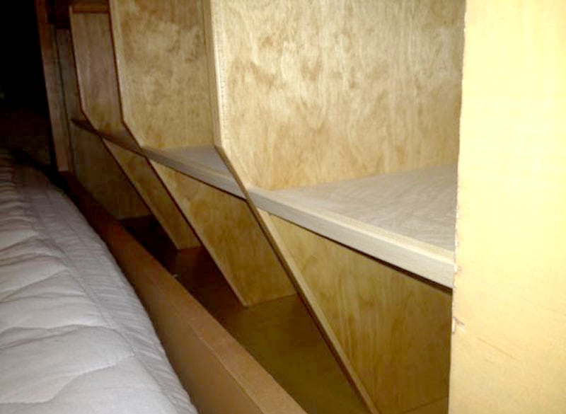 Angled Shelving To Easily Make The Bed