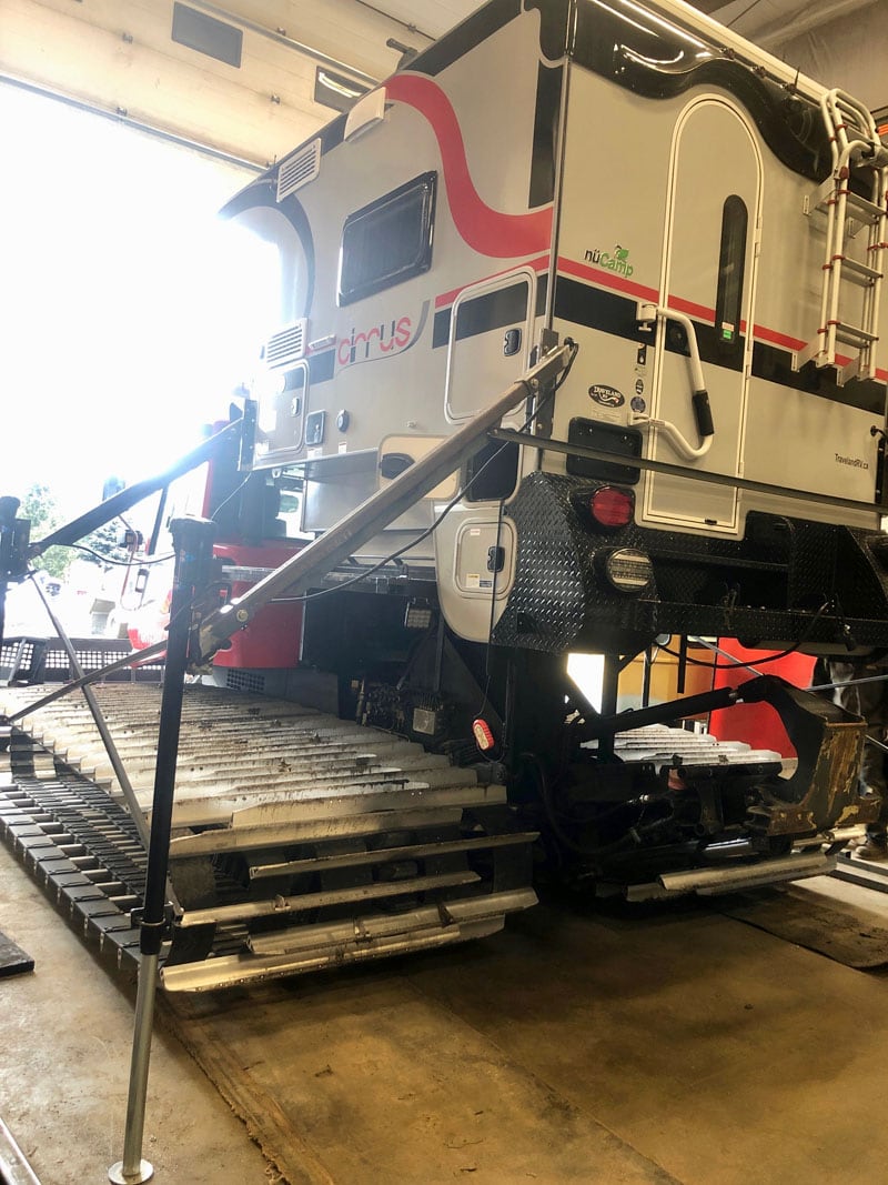 Cirrus Being Loaded On Snowcat