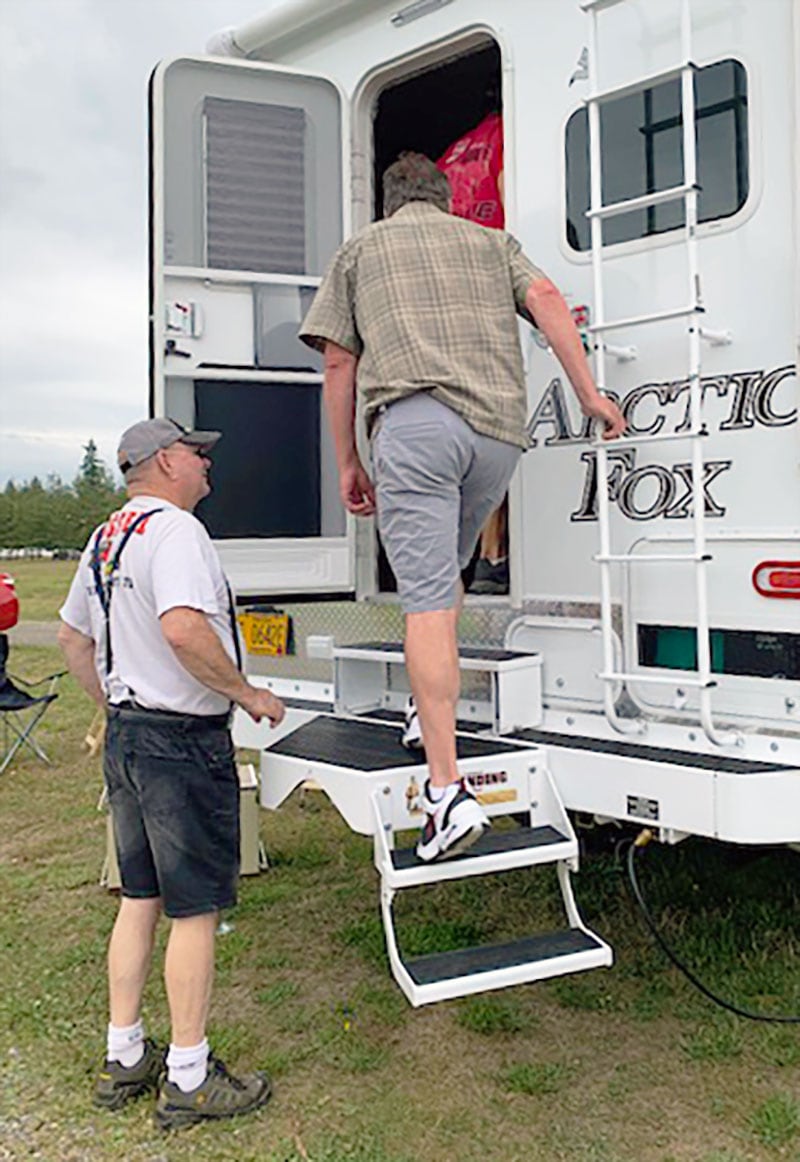 Doug Karr showing off the Arctic Fox at the raceway