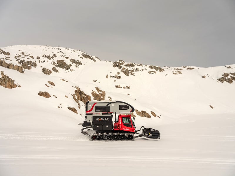 Snowcat And Cirrus Camper Side View