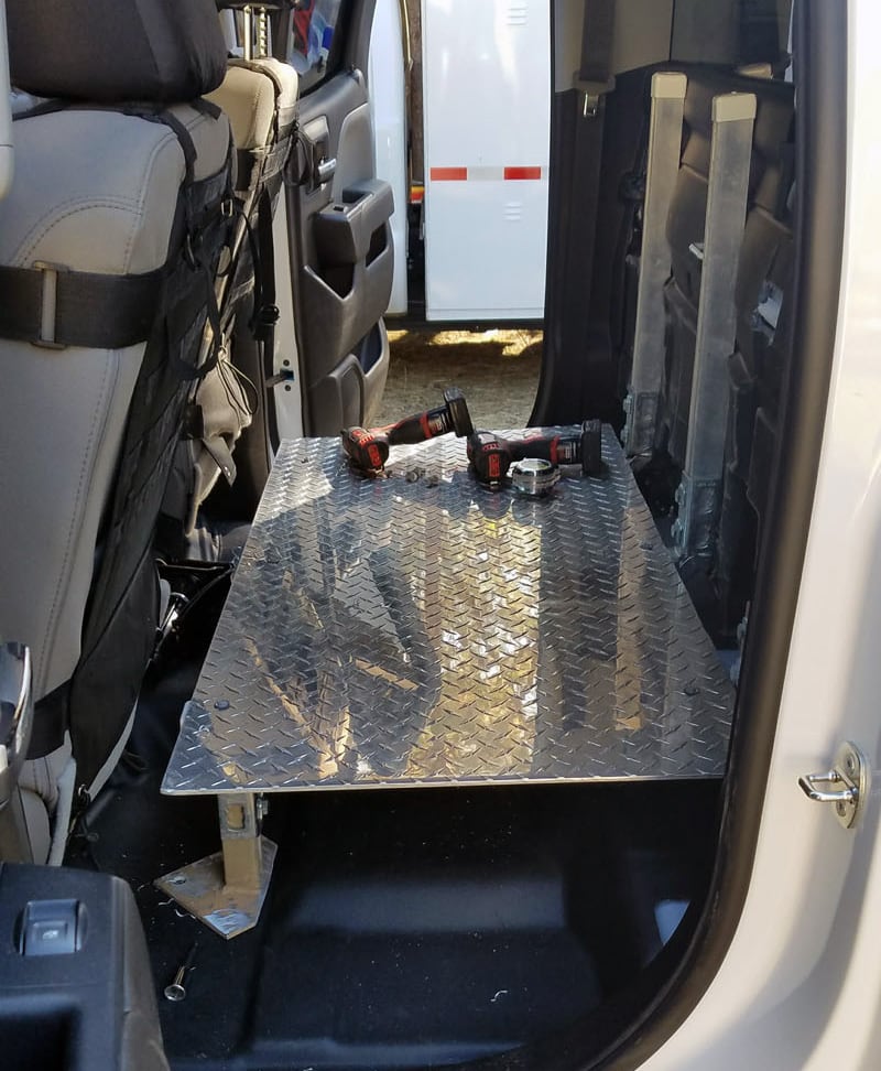 https://www.truckcampermagazine.com/wp-content/uploads/2019/10/Back-seat-storage-platform-drivers-side.jpg