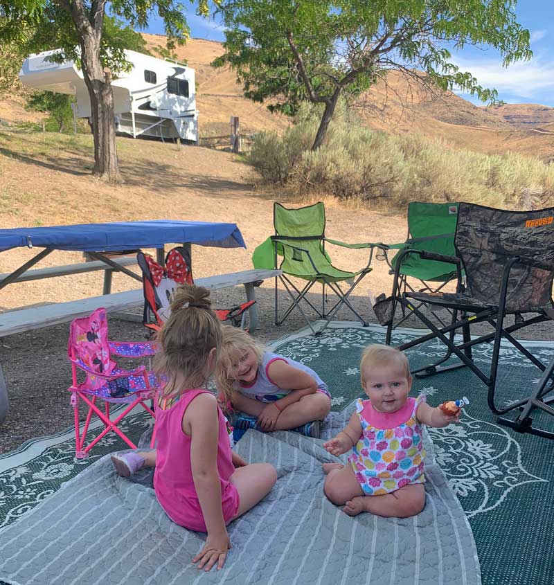 Kids Playing At Campsite