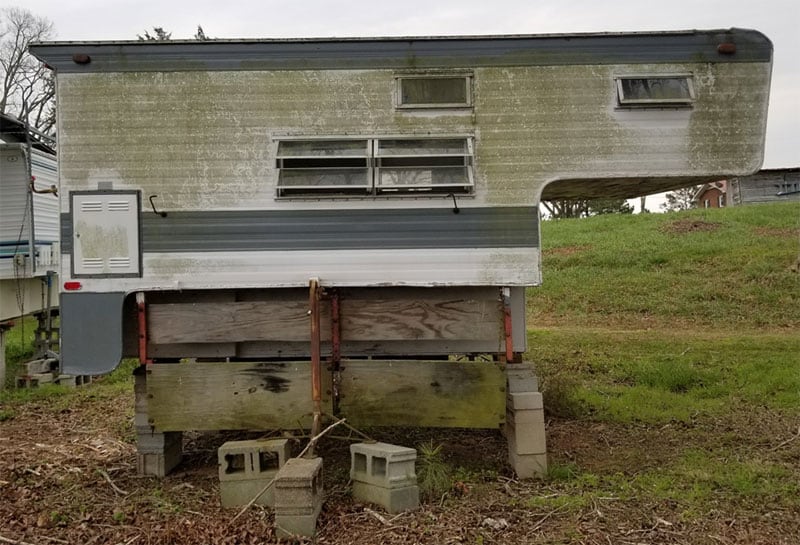 Camper In Field Needing Renovation