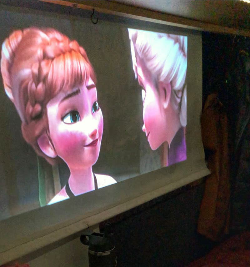 Watching Frozen Projector In Camper