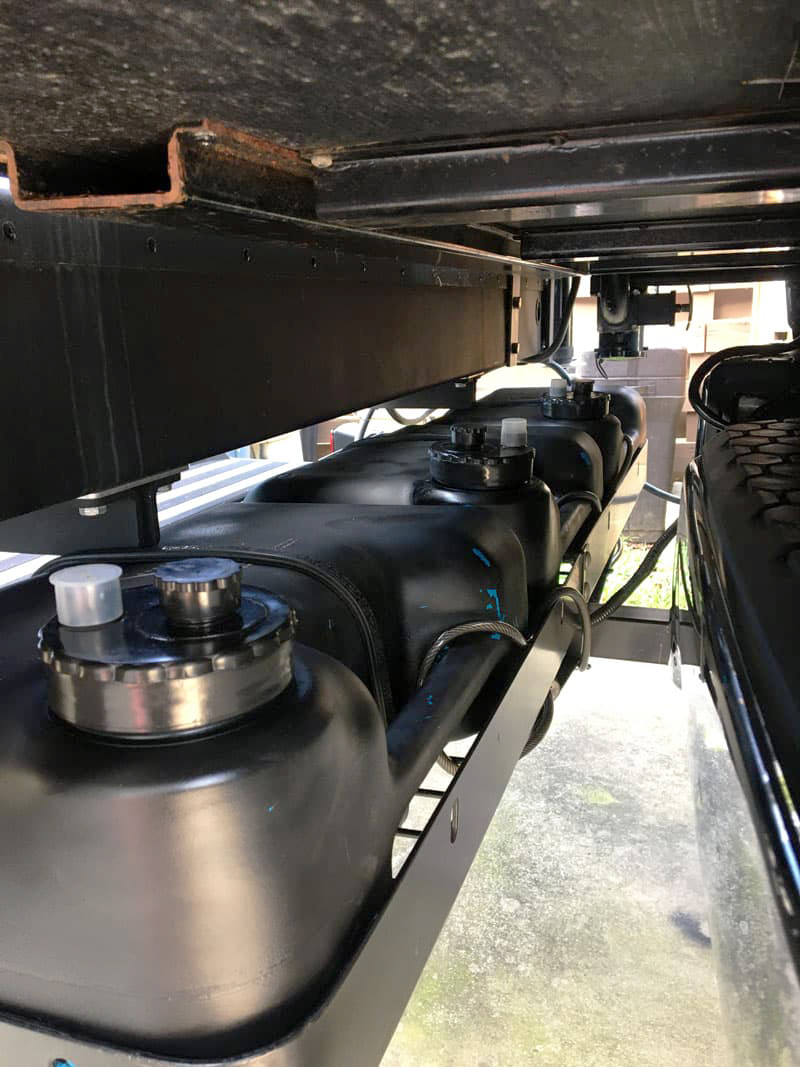 Aux Grey Tanks Under Palomino Camper