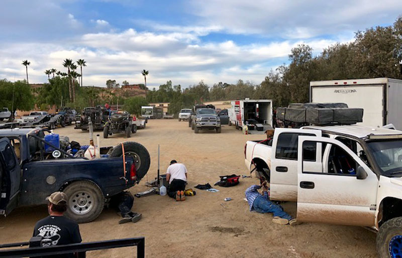 Fixing broken prerunners at Horsepower Ranch in Ensenada after running particularly grueling section of SCORE 1000.