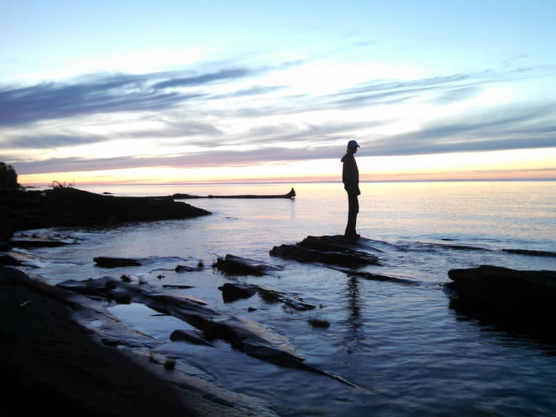 Sunset Standing On A Rock In Lake Superior