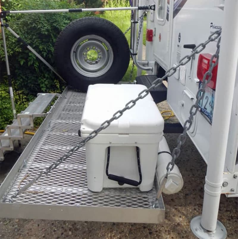 Cooler On Cargo Rack with open slots for rinsing off sand and dirt