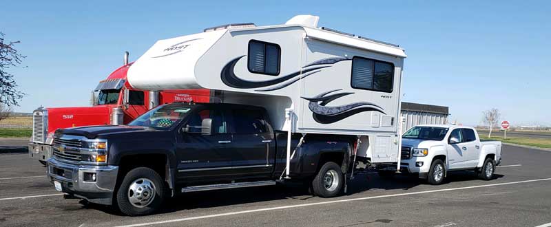 Host Camper Towing Pickup Truck