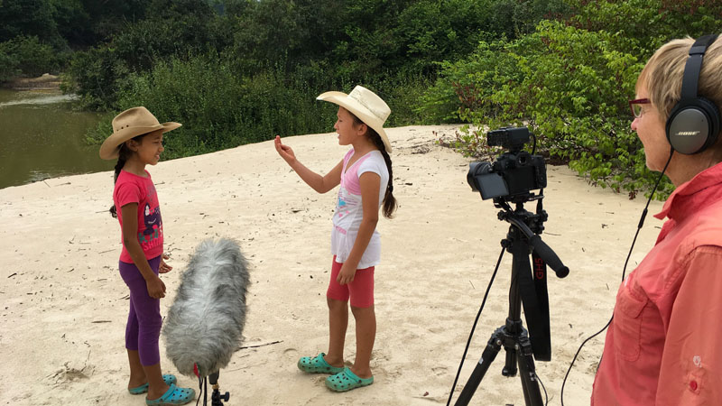 As Two Colombian Girls Sing Paula Films Them