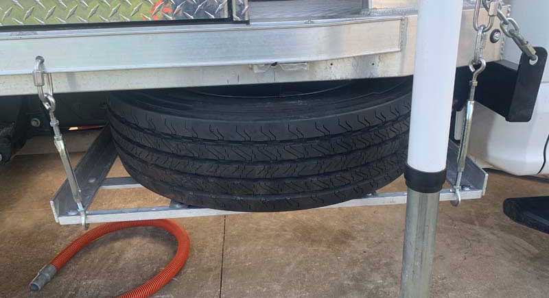 Tire Is Secured In Side Spare Tire Holder