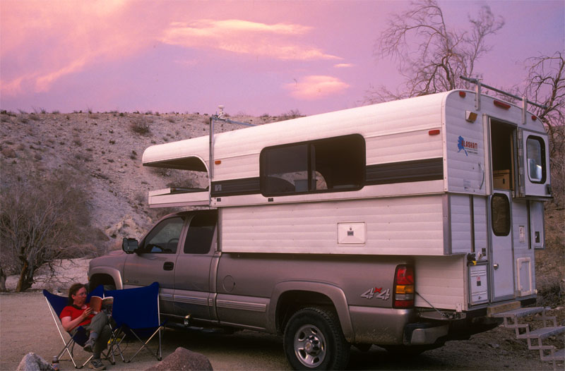 Eileen with our first Alaskan Camper, in Anza-Borrego Desert Sate Park, California.