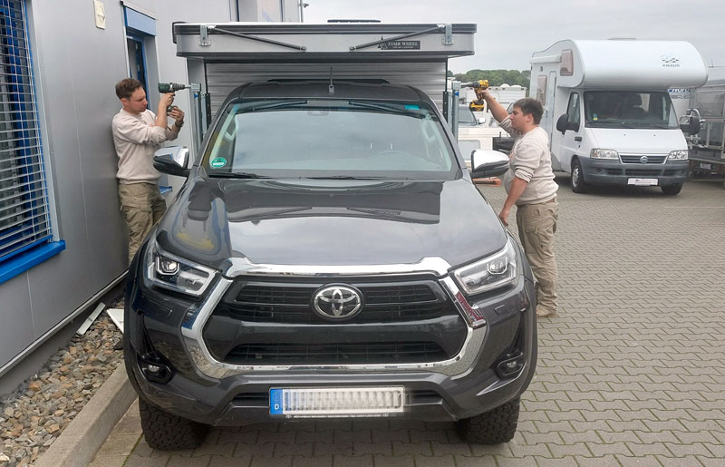 L Tobi and R Moritz at German Truck Camper dealership