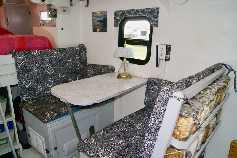 Dinette converts to 45 degree lounge for watching TV, or flat to a single bed