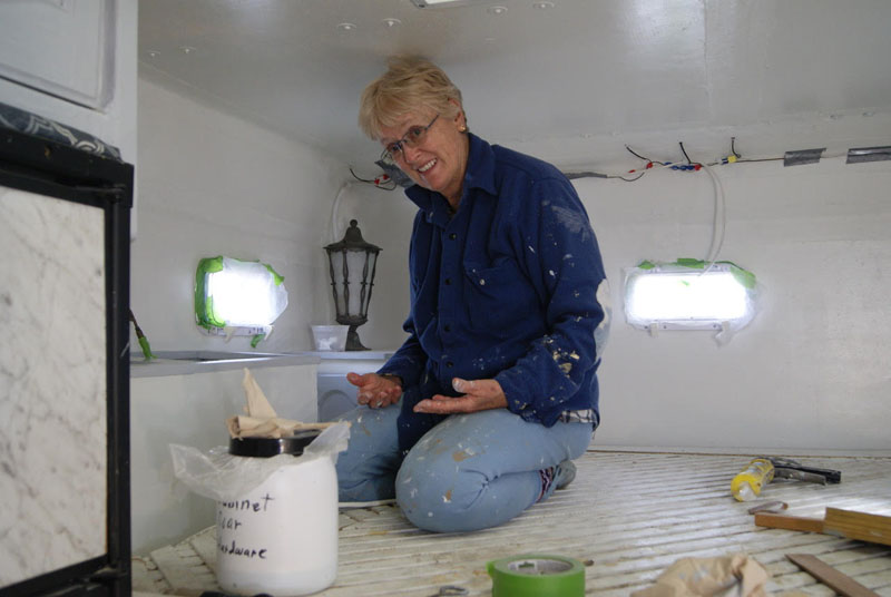 Ann painting the bed area