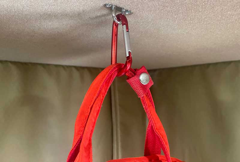 Hooks On Ceiling Holding Backpacks
