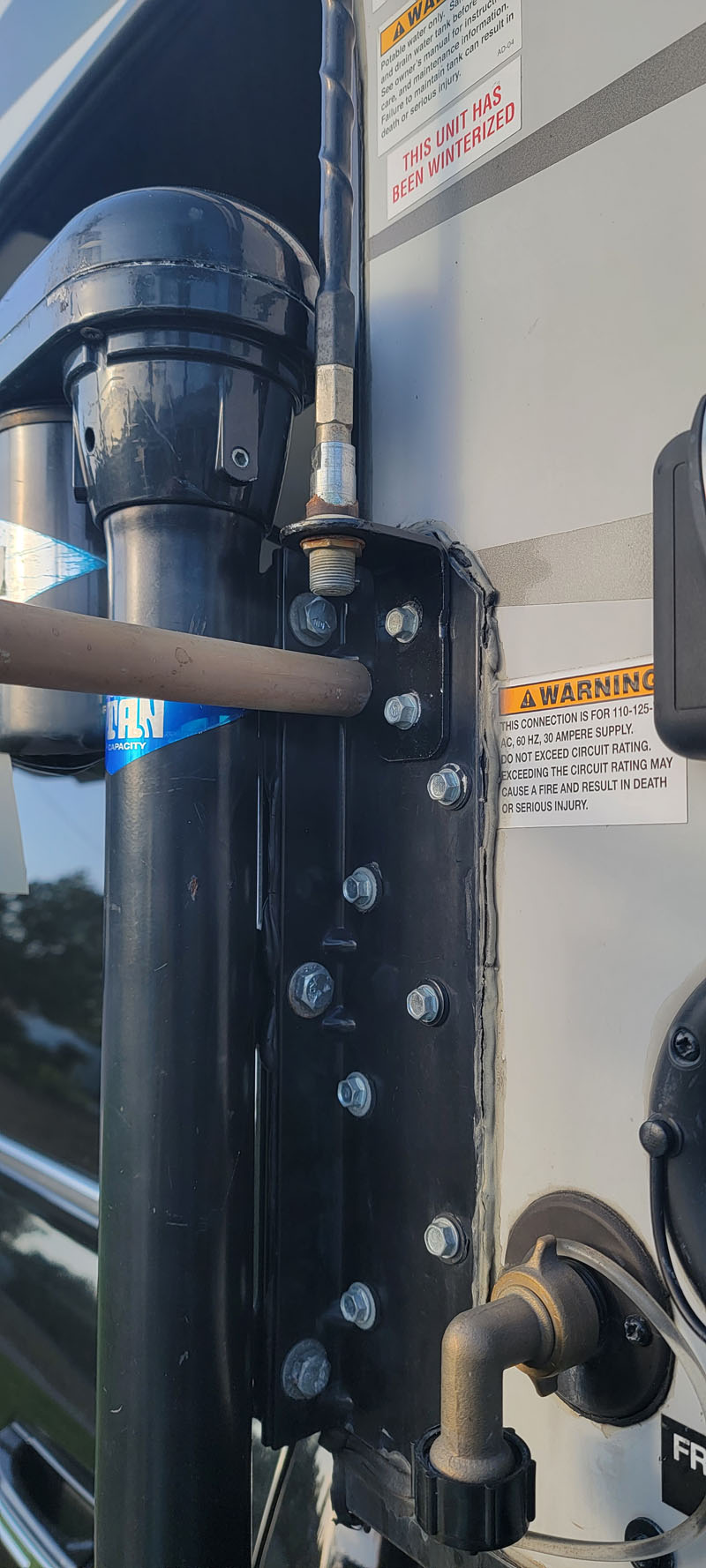 Quick And UnDirty Outdoor Shower hooked to camper jack bracket