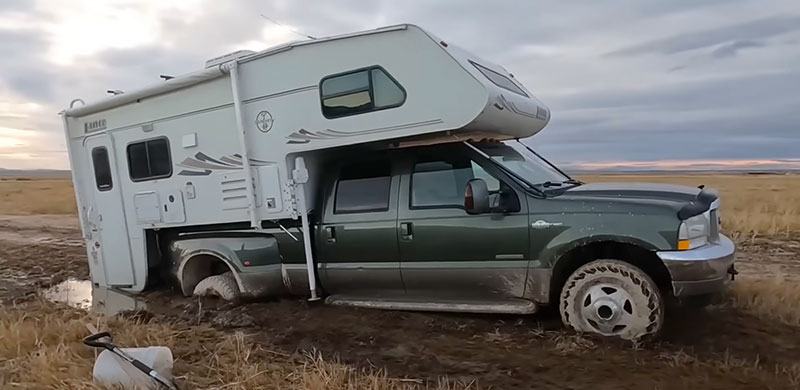 Lance 1161 And Ford F350 Stuck In Swamp