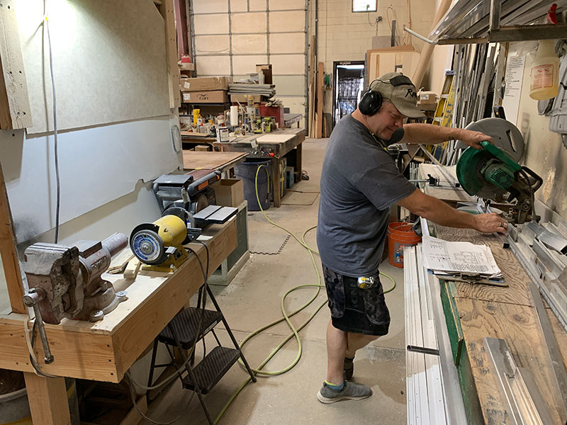 Phoenix Factory Robby Checks Plans Cuts Aluminum