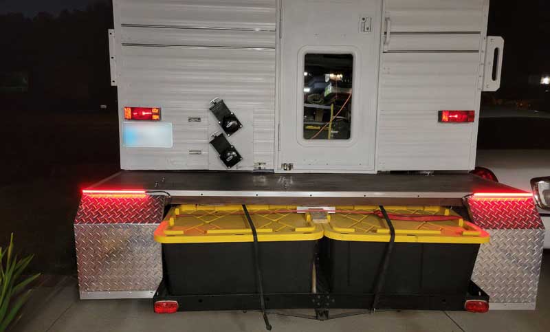 Camper Porch And Storage At Night With Lights