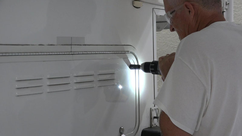 RV Emergency Electrical Hookup Drilling Hole Thru Battery Door