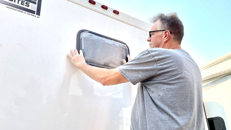 Putting In Window Of Total Composites Camper