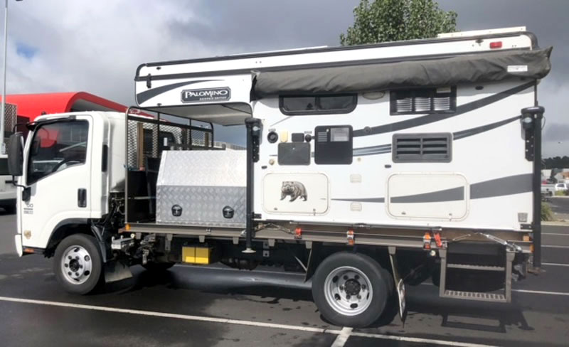 Side View Isuzu 400 And Camper