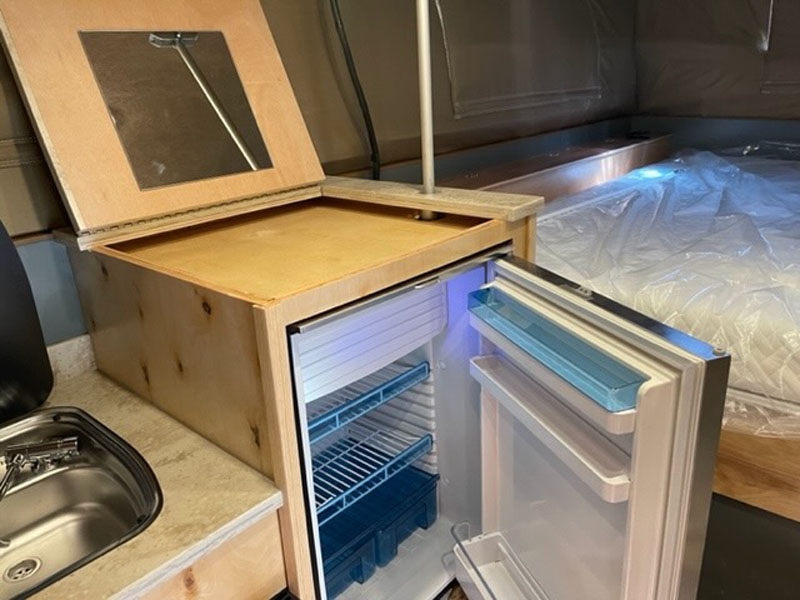 Phoenix Camper Refrigerator And Storage Overtop