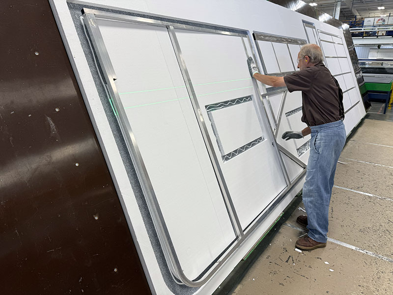 NuCamp Tech Layup Pressing Frame Into CNC Cut Insulation