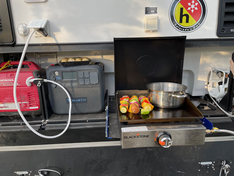 Slide Out Grill Spare Propane Tank And Water From The Camper
