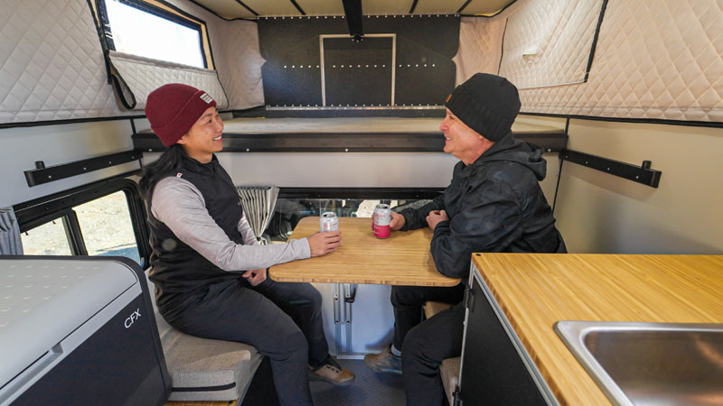 Four Wheel CampOut Couple In Dinette