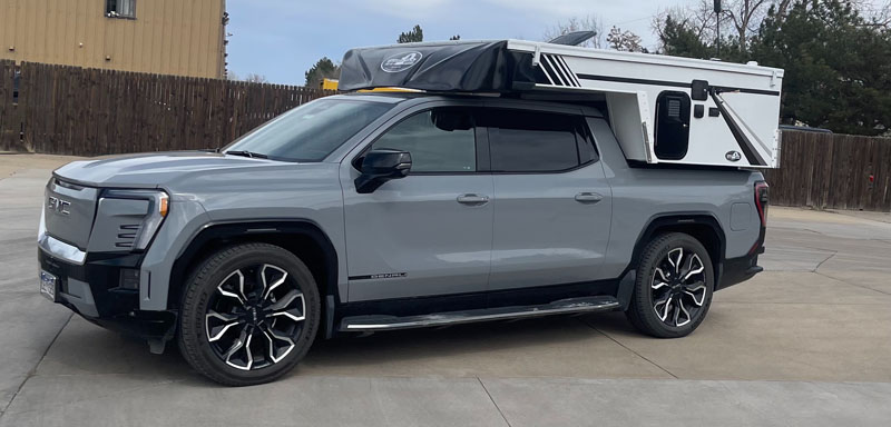 GMC Sierra EV With A Camper On It