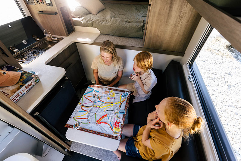 Adventurer 65RB Dinette Three People Playing A Game