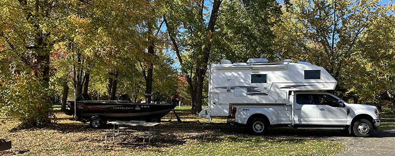 Northern Lite 10-2 camper and Crestline Fish Hawk 1650 boat