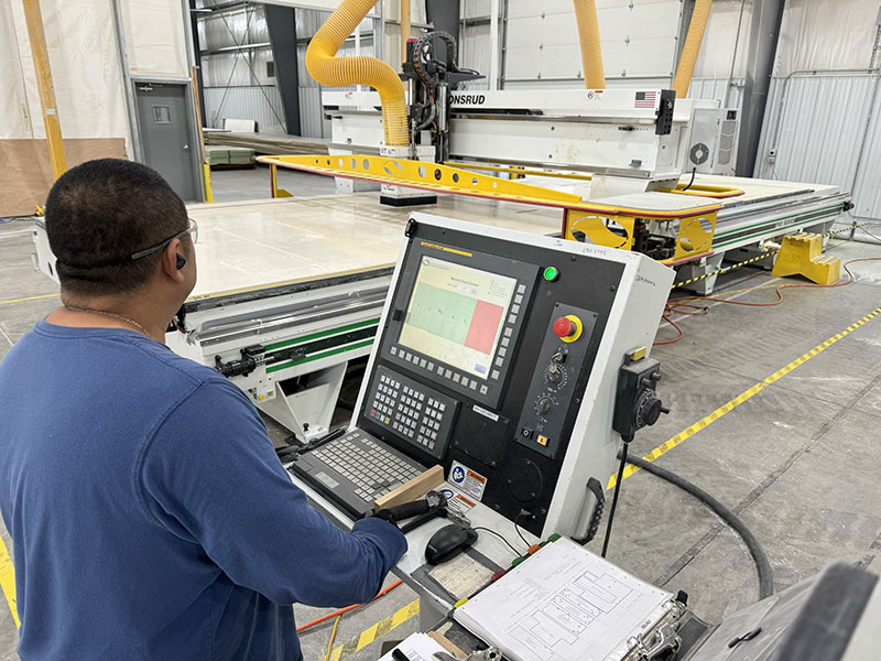 Adventurer truck campers CNC operator with machine