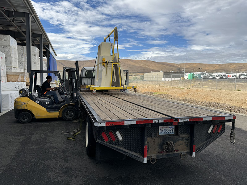 Adventurer truck campers delivering to production facility 