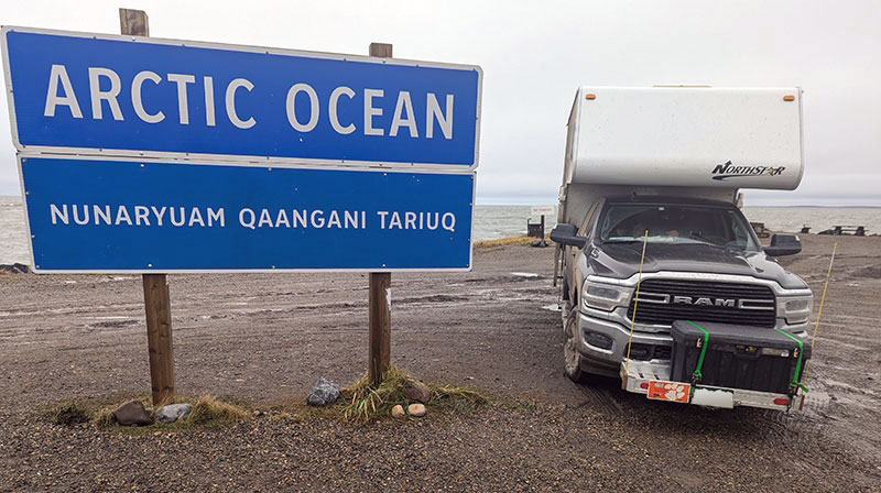 Dempster Mud and Arctic Ocean sign with the Northstar