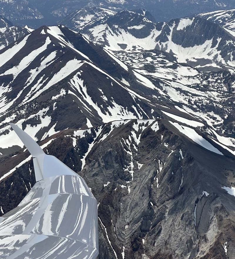 Soaring Above Snow Capped Mountains