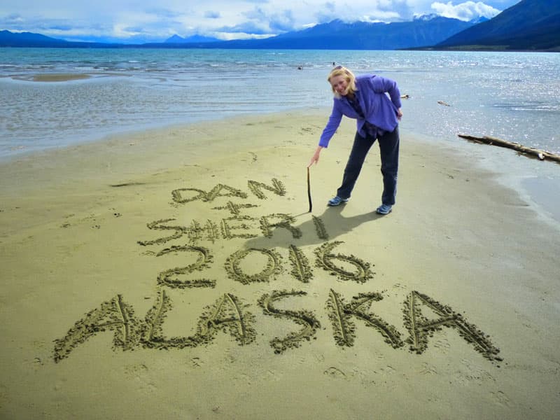 Alaska sign in sand