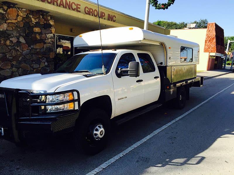 Alaskan flatbed 11-foot truck camper