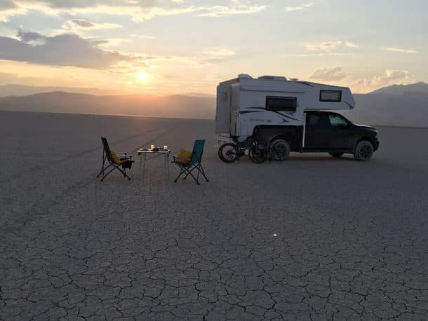 #250 - Glen and Trudy PritchardAlvord Desert, SE Oregon2017 Ram 35002017 Northstar Laredo SCCamera Used - iPhone SEThis felt like camping on the moon!  In the center of the Alvord Desert, with nobody else in site as far as we could see, it was peaceful and surreal.  You have to watch the weather when camping here so that you do not get caught in a thunderstorm or downpour.  This was a September day so the weather was perfect and not too hot.  We set out our table, a bottle of wine, and dinner.  We felt like we had the entire landscape to ourselves.