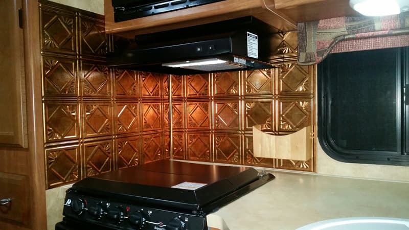 Stamped tin backsplash in camper