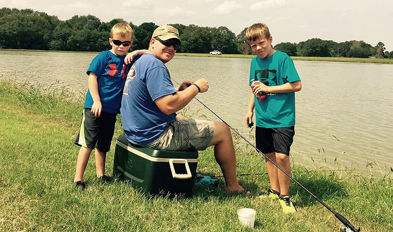 Troy O'Rourke fishing with his kids